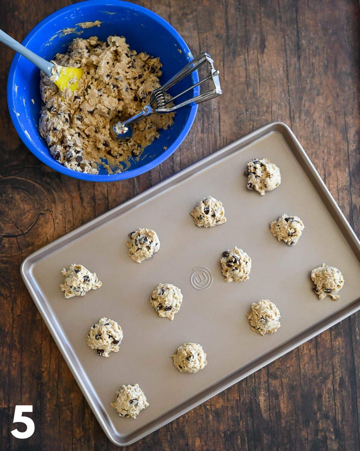 Oatmeal cookies on a baking sheet ready to bake. 