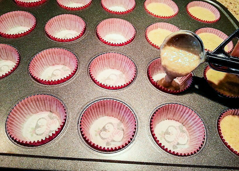 filling a mini muffin pan with applesauce bite batter