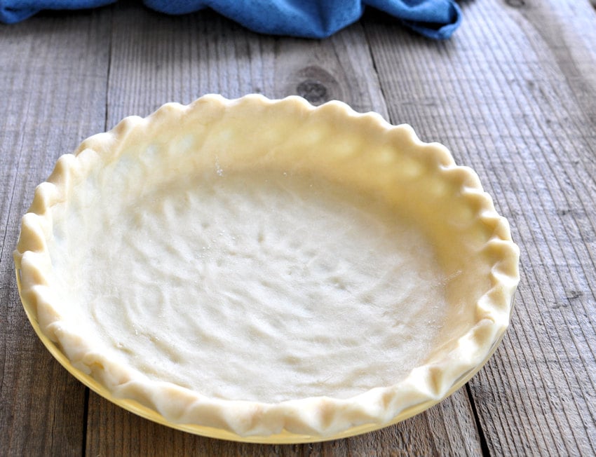 unbaked pie shell in a 9" pie plate