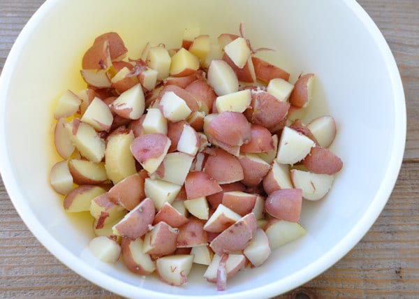 cut up cooked red potatoes in a bowl