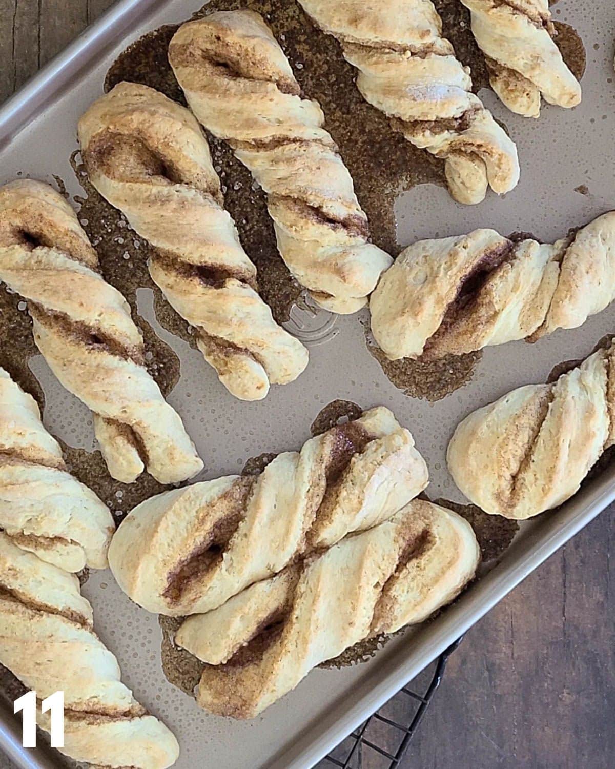 Baked cinnamon twists on a  baking sheet. 