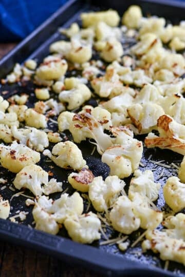 Roasted cauliflower on a baking sheet.