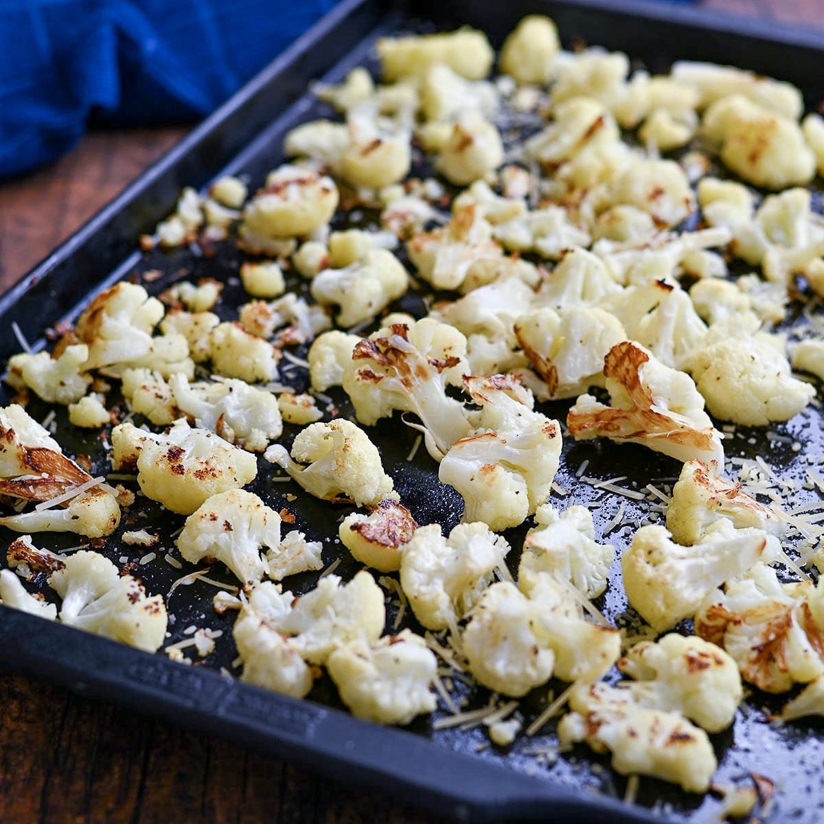 Roasted cauliflower on a baking sheet.