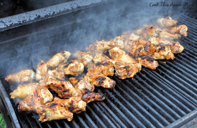 chicken wings on a smokey grill