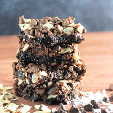 A stack of coconut, almond chocolate brownies.