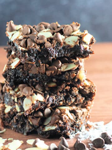 A stack of coconut, almond chocolate brownies.