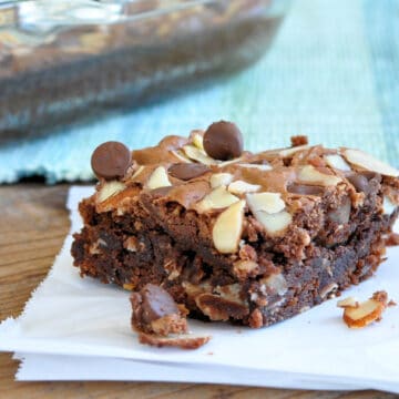 brownies topped with chocolate chips and almonds