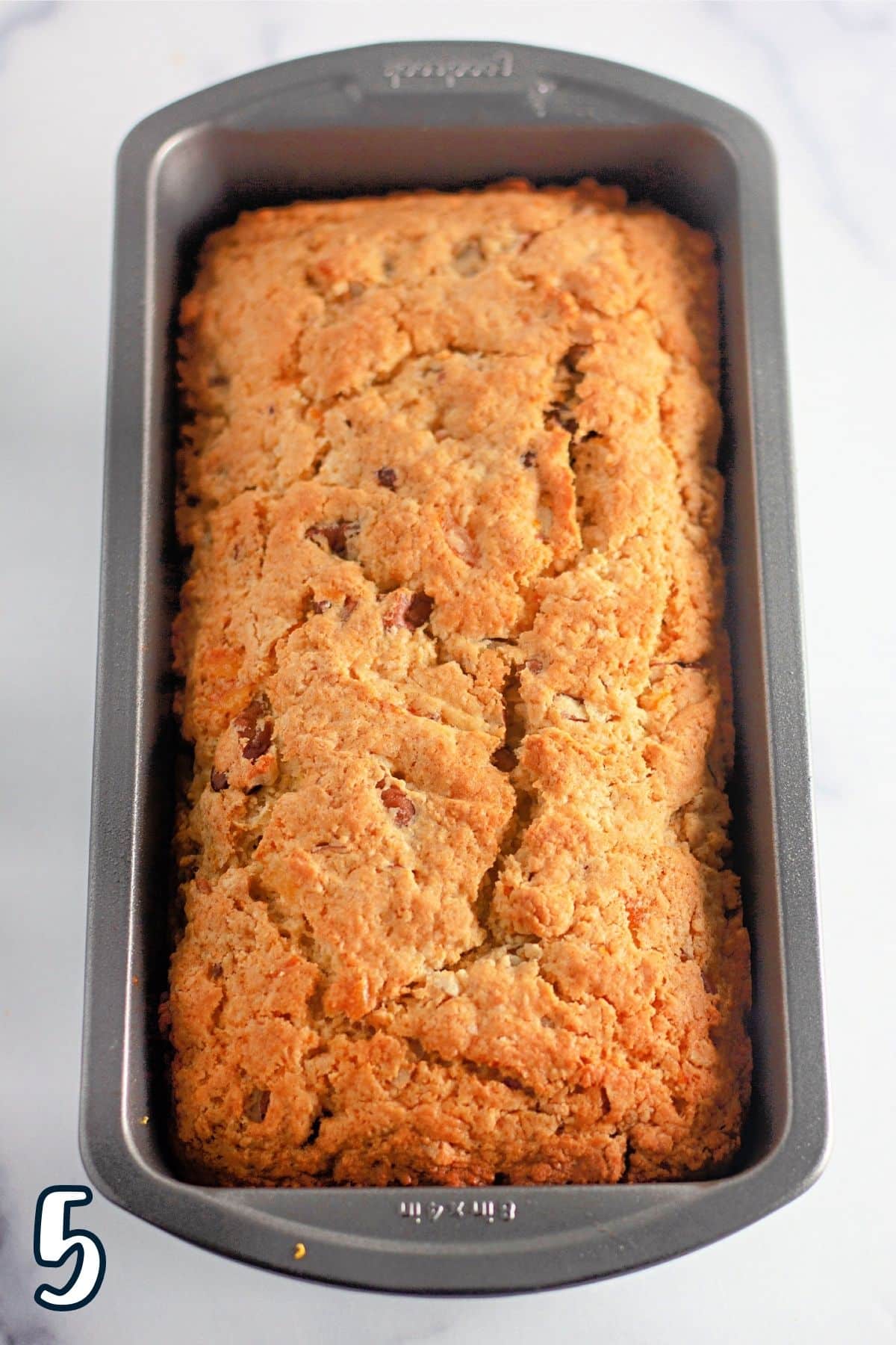 Just baked orange quick bread still in the loaf pan. 