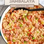 Top view of a pot filled with savory sausage jambalaya, garnished with green onions and served with tongs. Made using Hillshire Farm smoked sausage for the best smoked sausage flavor in every bite.