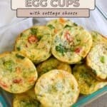 Spinach Egg Cups packed with chopped vegetables and cottage cheese fill a glass dish, offering a wholesome and flavorful breakfast option.