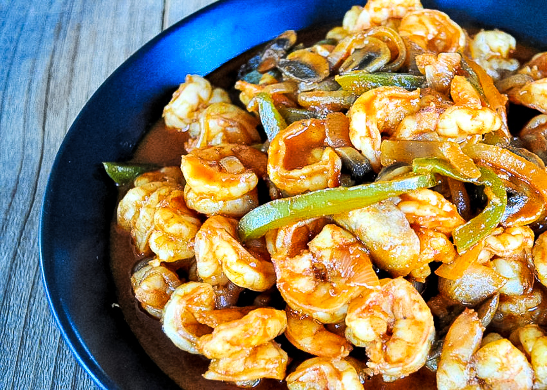 spicy shrimp in a black bowl