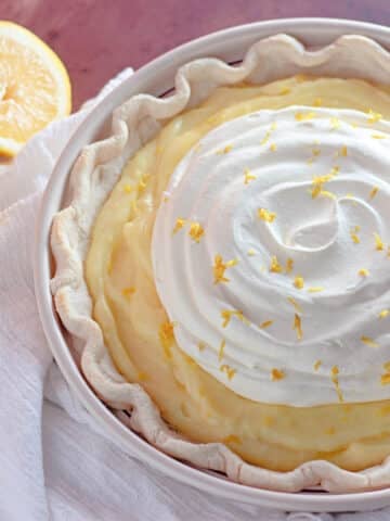 A creamy lemon pie with whipped topping.