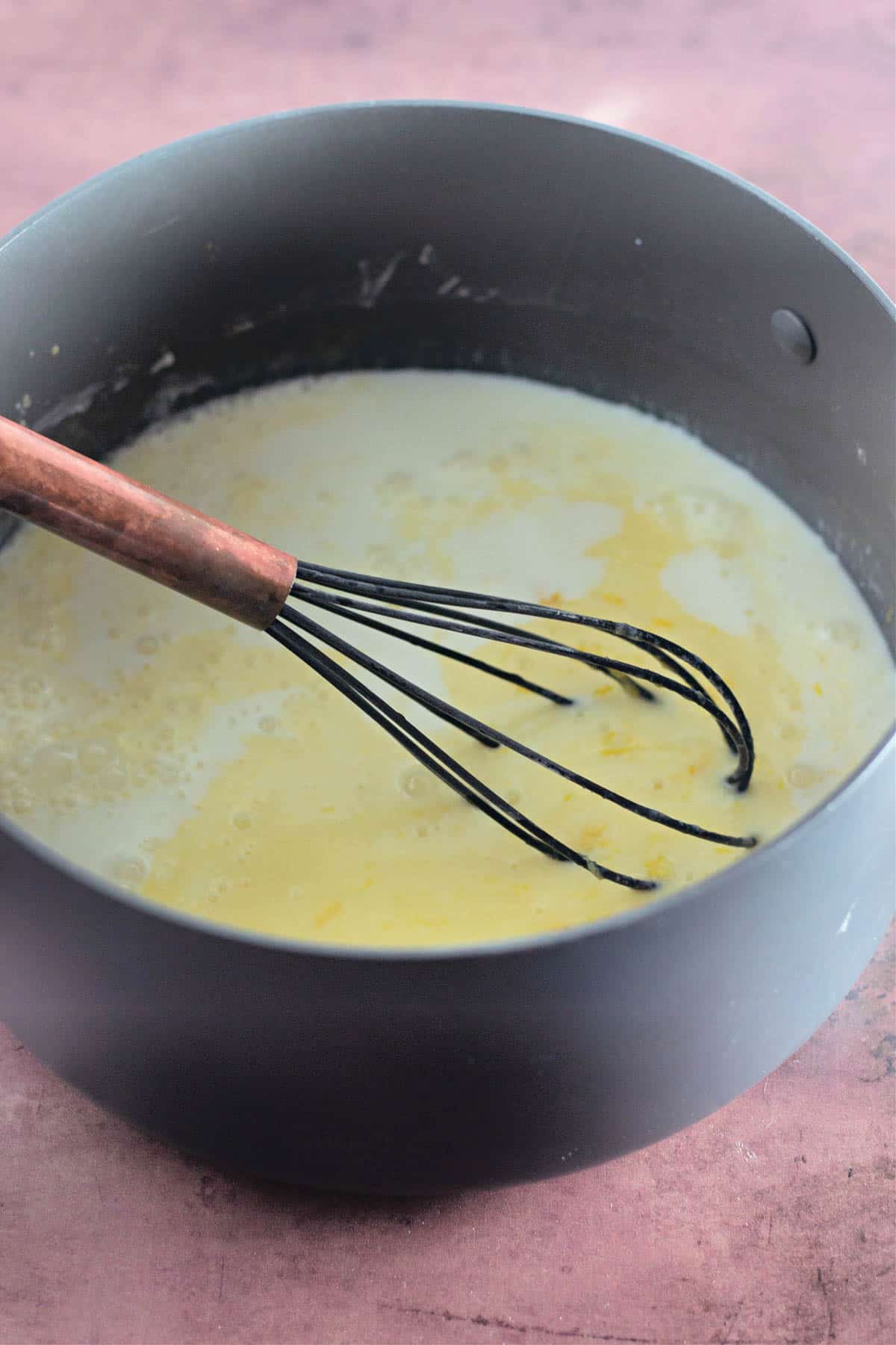 Cornstarch mixed with milk, egg yolks, lemon juice, lemon rind, and butter.