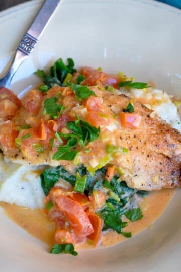 spinach and tomatoes over tilapia over mashed potatoes