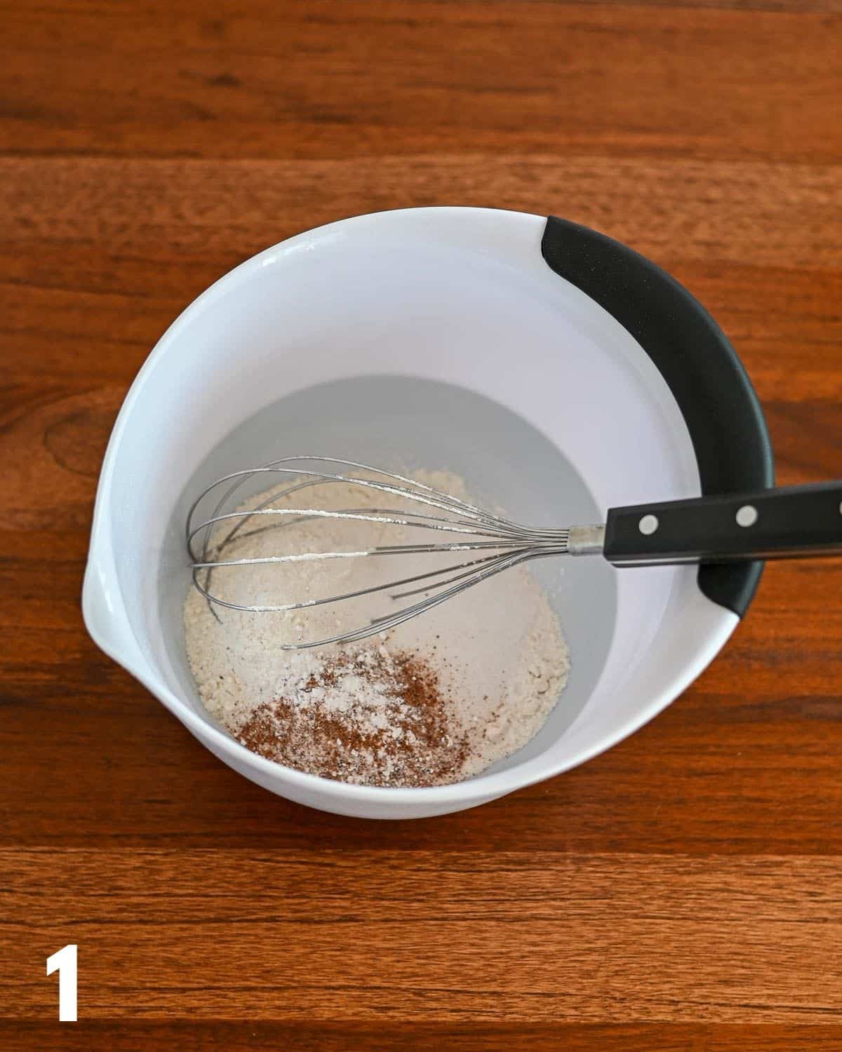Flour, baking powder and soda, salt, and nutmeg in a mixing bowl. 
