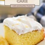A slice of Lemonade Cake Marshmallow Frosting, garnished with lemon zest and served with lemon slices, offers a sweet citrus treat.