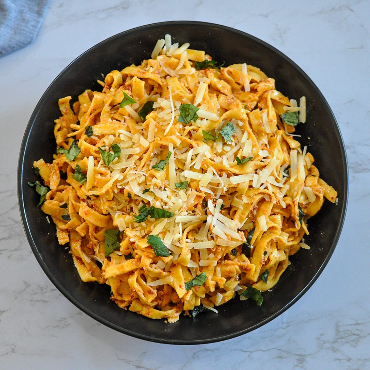 overhead picture of pasta with sun-dried tomato cream sauce