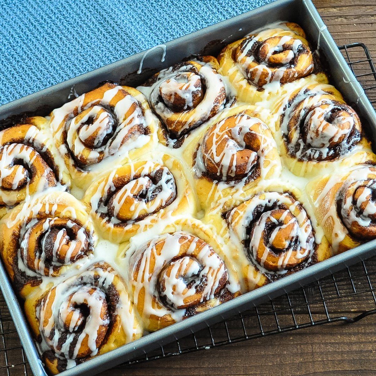 just baked chocolate cinnamon rolls in a silver pan