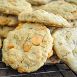 butterscotch chip cookies piled on a wire rack
