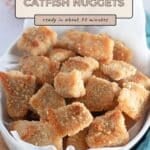 A bowl of golden Baked Catfish Nuggets with text overlay: "Baked Catfish Nuggets, ready in about 30 minutes." Try this easy baked catfish nuggets recipe for a quick and tasty meal.