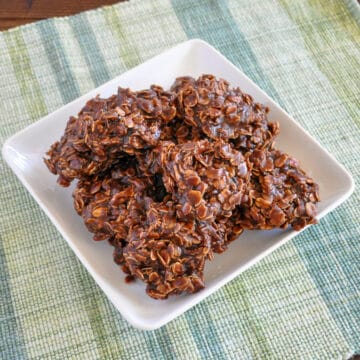 a plate of oatmeal chocolate no bake cookies on a green and blue plaid mat