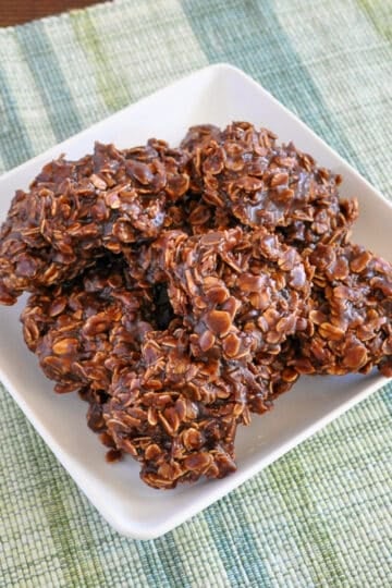 a plate of oatmeal chocolate no bake cookies on a green and blue plaid mat
