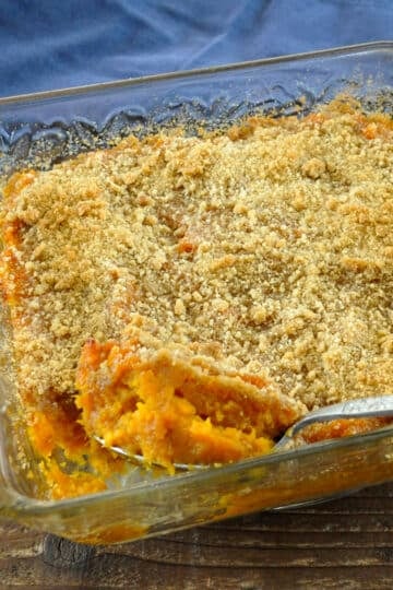 mashed sweet potatoes in a clear casserole dish