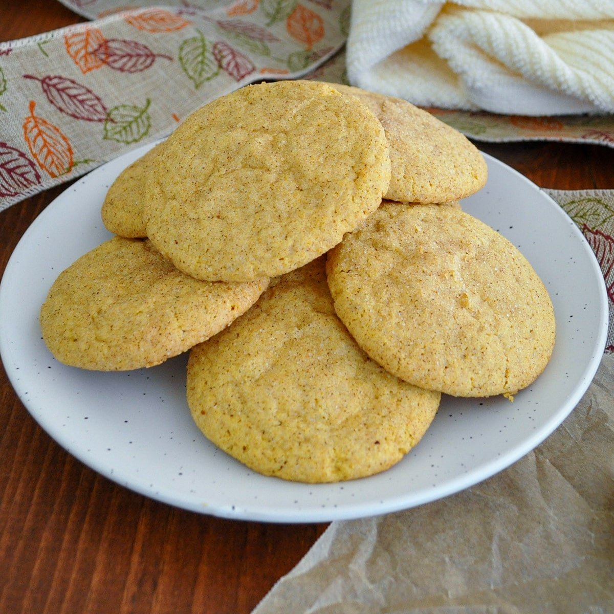 pumpkin snickerdoodle cookies stack on a white plate