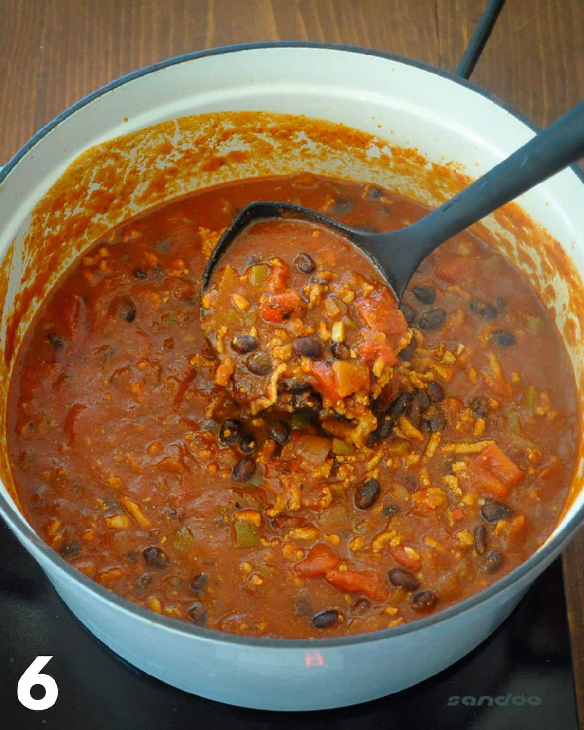 Finished ground turkey chili with chipotles in a large pan.