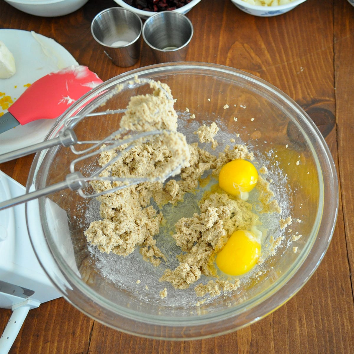 butter creamed with brown sugar and eggs in a glass bowl
