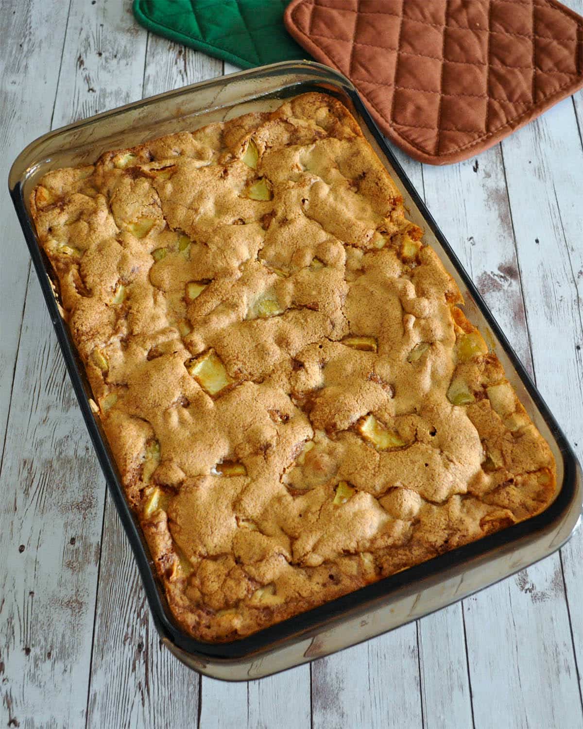 just baked apple cake in a baking dish