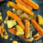 roasted carrots on a spatula pinterest image