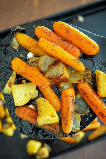 roasted carrots on a spatula close up