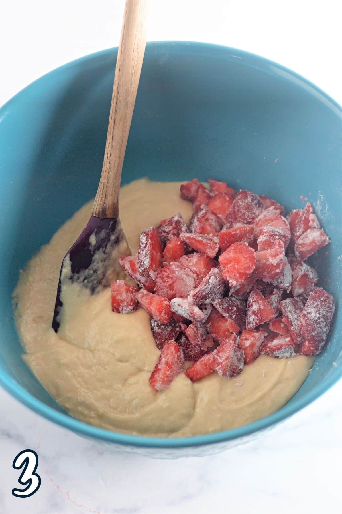 Strawberries that have been dusted with flour added to coffee cake batter. 