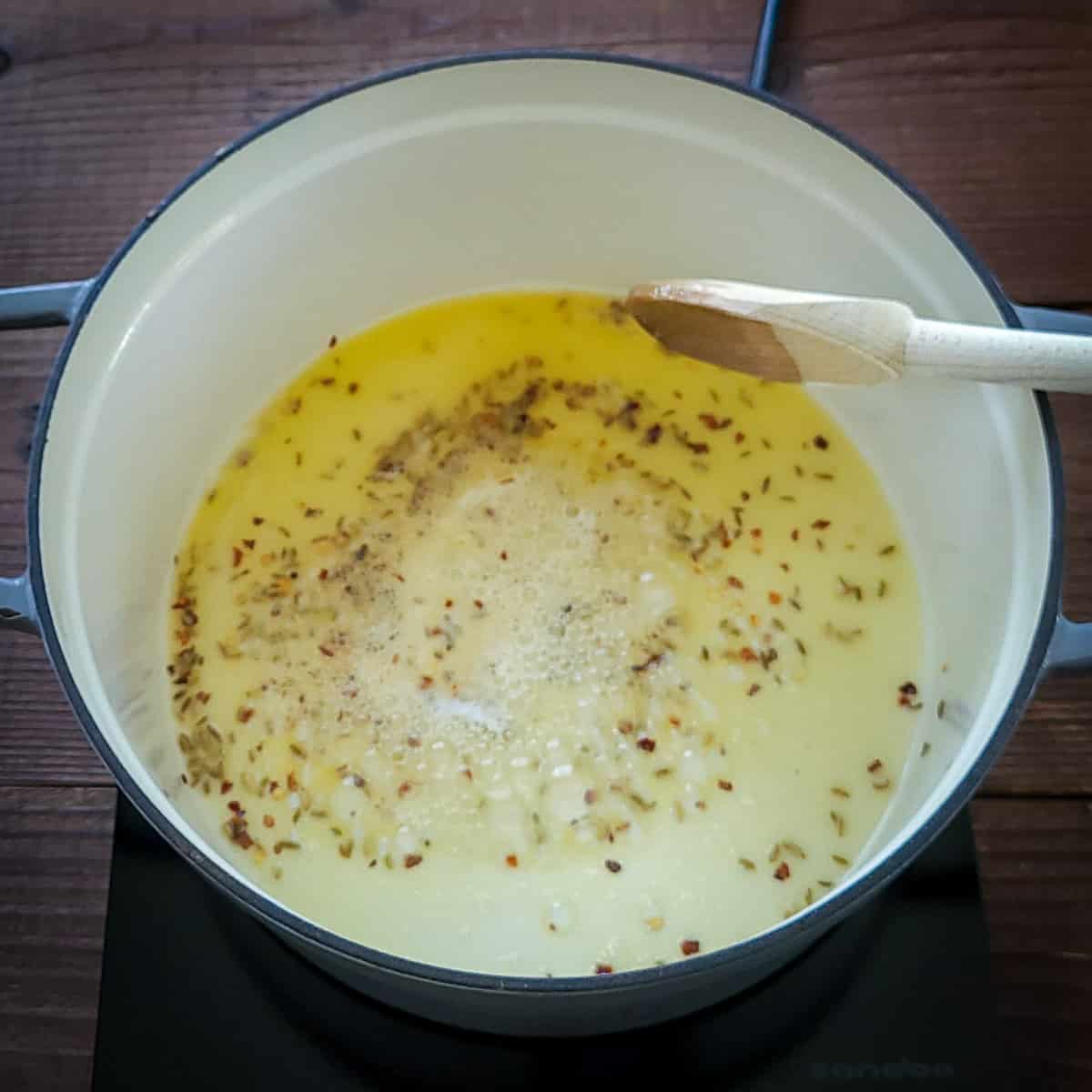 olive oil and butter in a large pan with fennel seed and red pepper