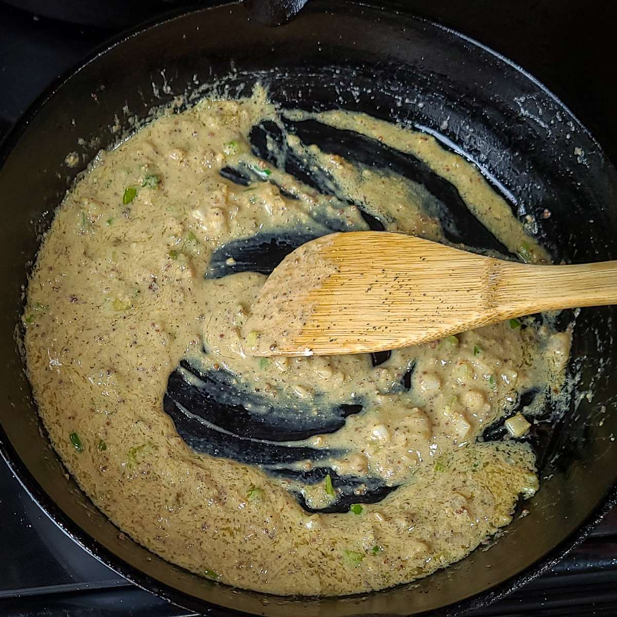 green onions, garlic, sour cream, dijon mustard and butter in a skillet