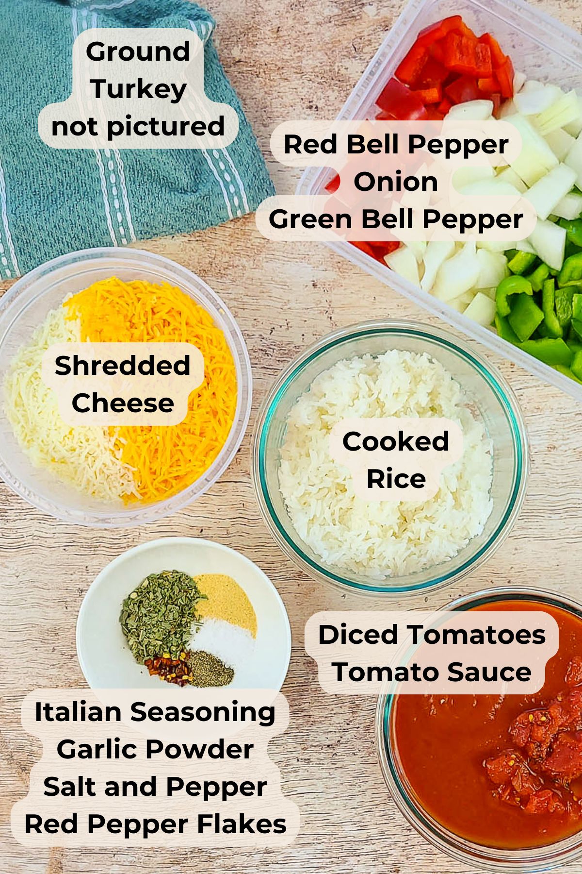 Ingredients for a Simple Bell Pepper Casserole, including rice, cheese, seasonings, diced bell peppers and veggies, and tomato sauce on a wooden surface.