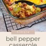 Simple Bell Pepper Casserole with ground turkey and melted cheese, featuring colorful bell peppers, served hot in a glass dish on a cooling rack.