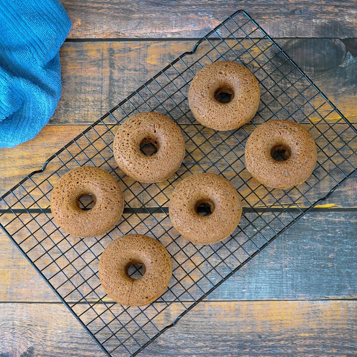 baked donuts cooling on a wire rack