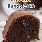 A delectable slice of Chocolate Espresso Bundt Cake with a luscious chocolate glaze rests on a pristine white plate.