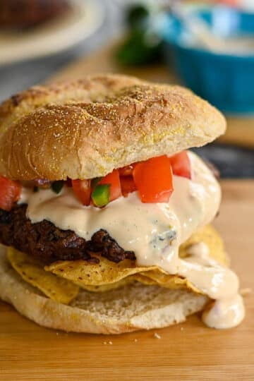 A closeup photo the ready to eat nacho burger.