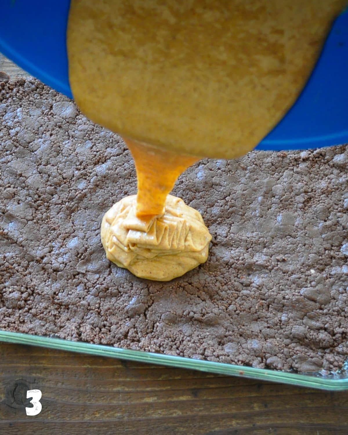 Almond butter filling being poured over cookie base.