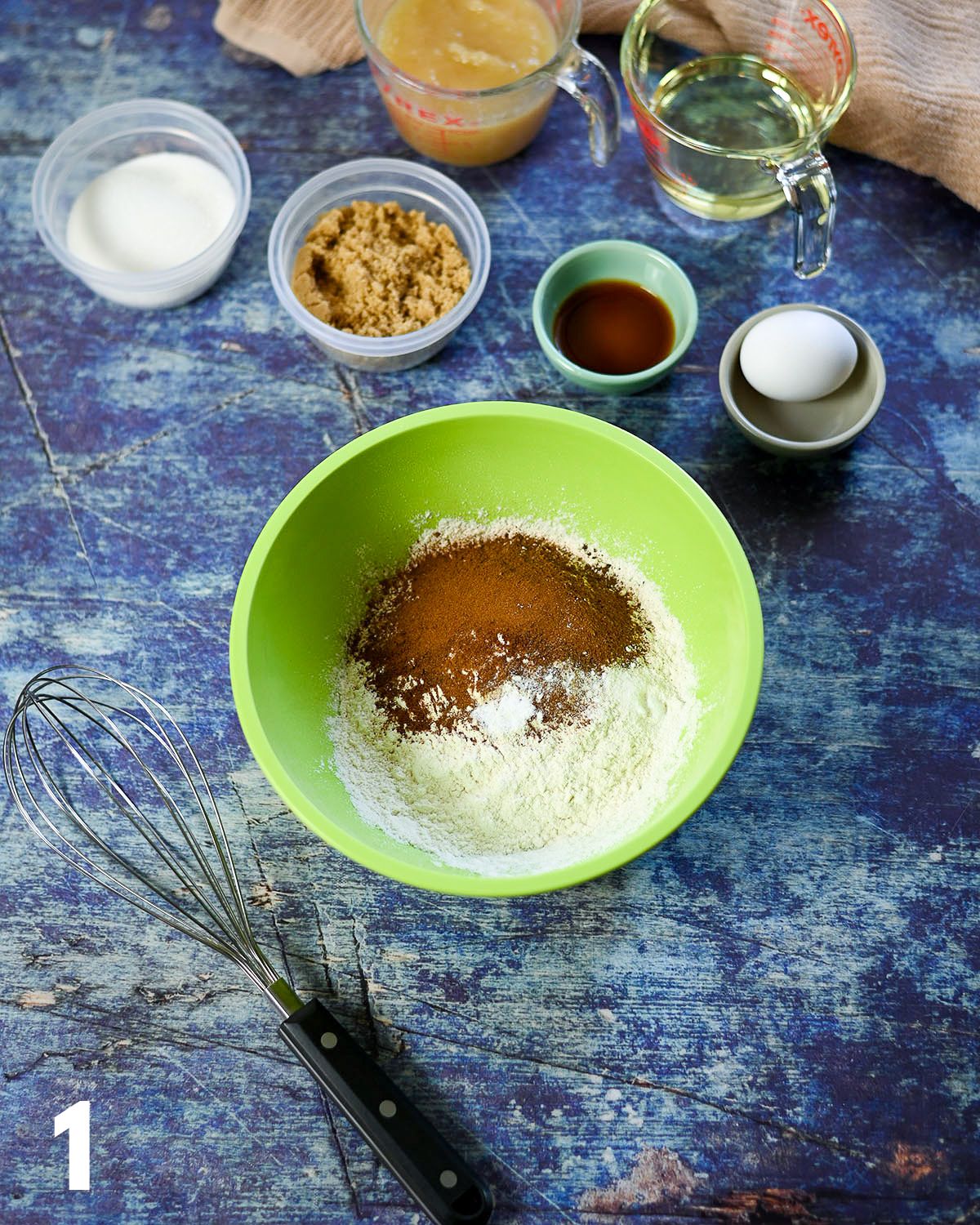 Dry ingredients in a green bowl for cake. 
