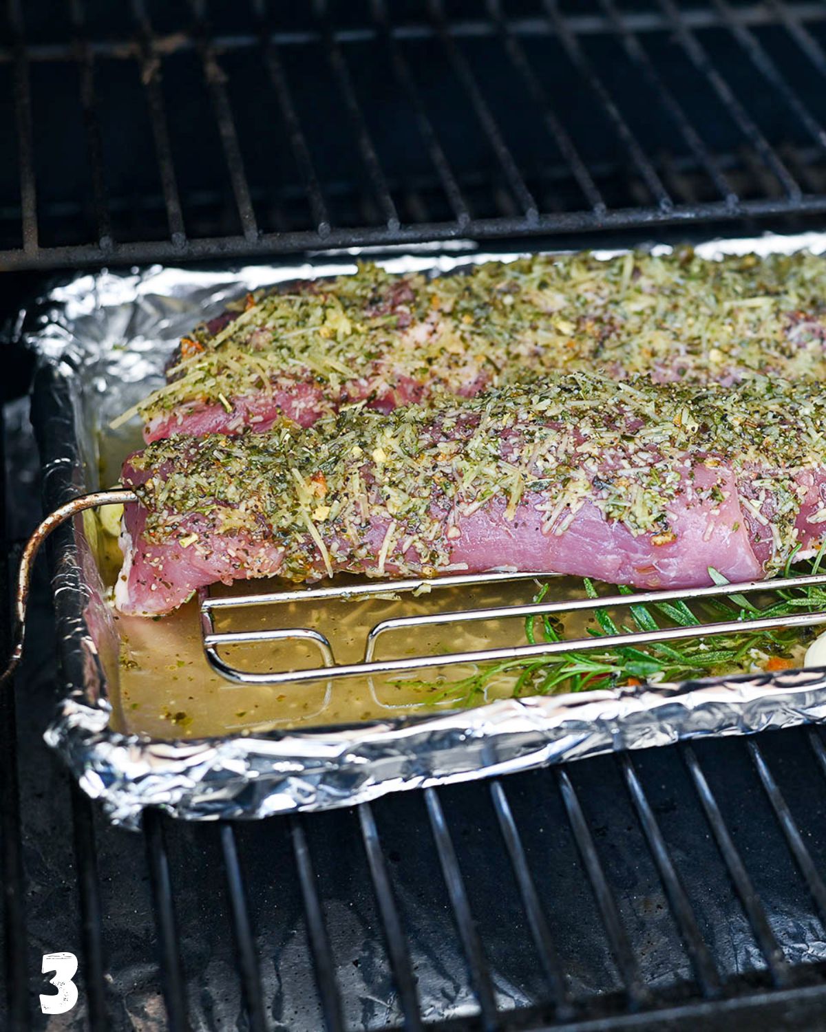 Pork tenderloins with a thermometer inserted being placed in a pellet grill. 
