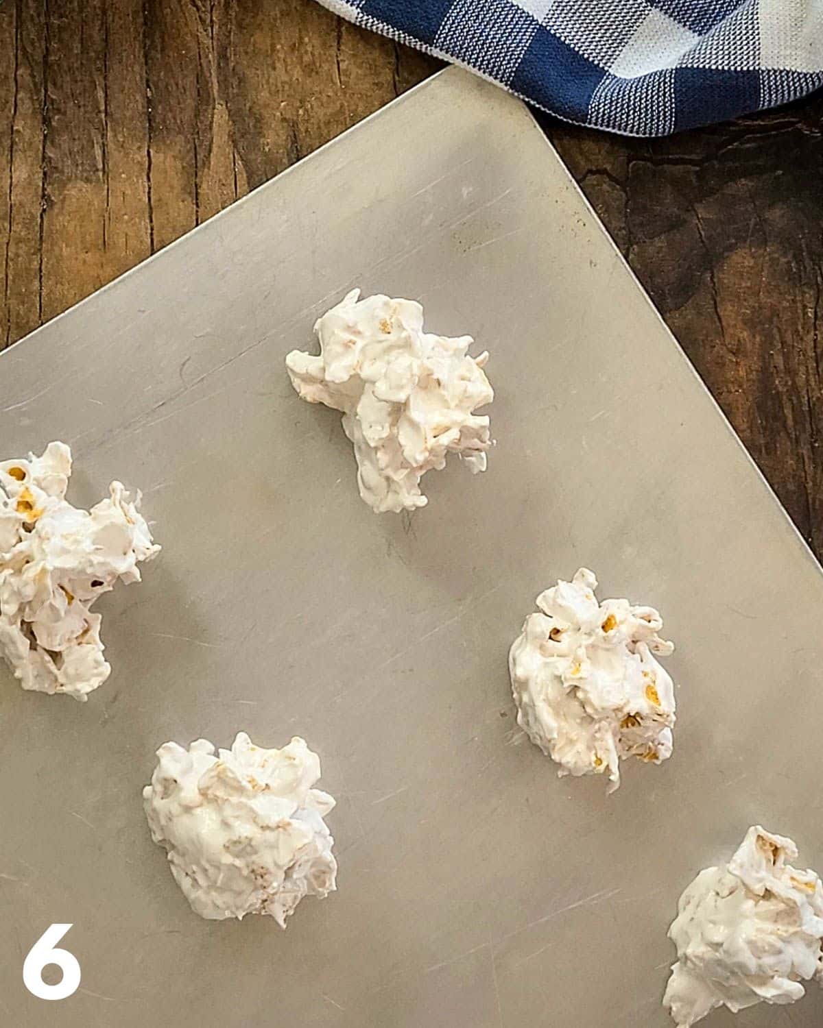 Corn flake meringue cookies on a baking sheet ready for the oven.