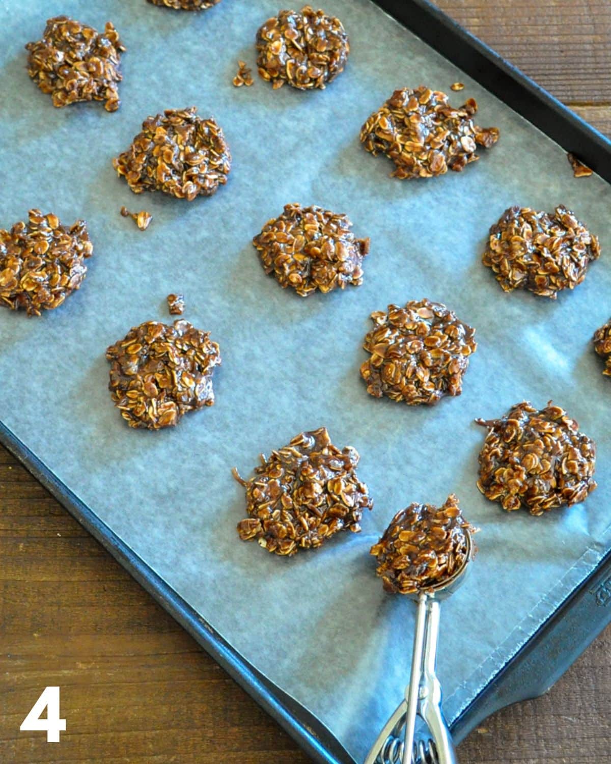 Unbaked cookies on parchment on a cookie sheet.