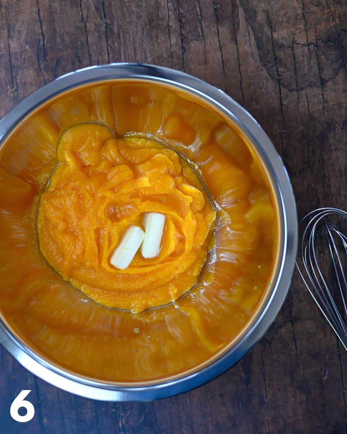 Butternut squash puree and butter in a mixing bowl. 