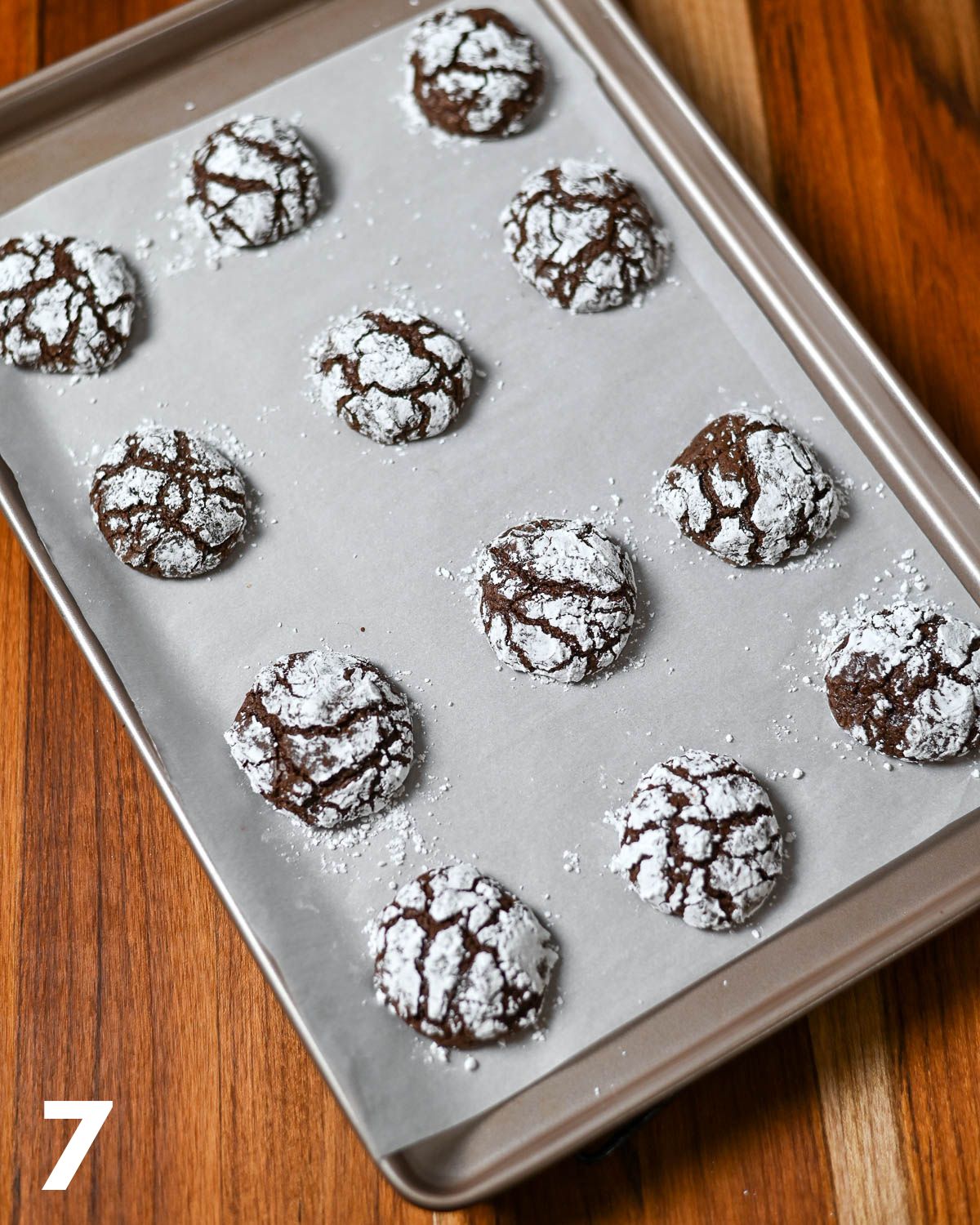 Just baked chocolate crinkles on a cookie sheet. 