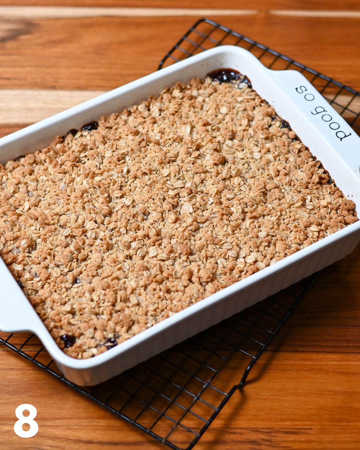 Just baked, golden brown, oatmeal jam bars in a baking dish. 