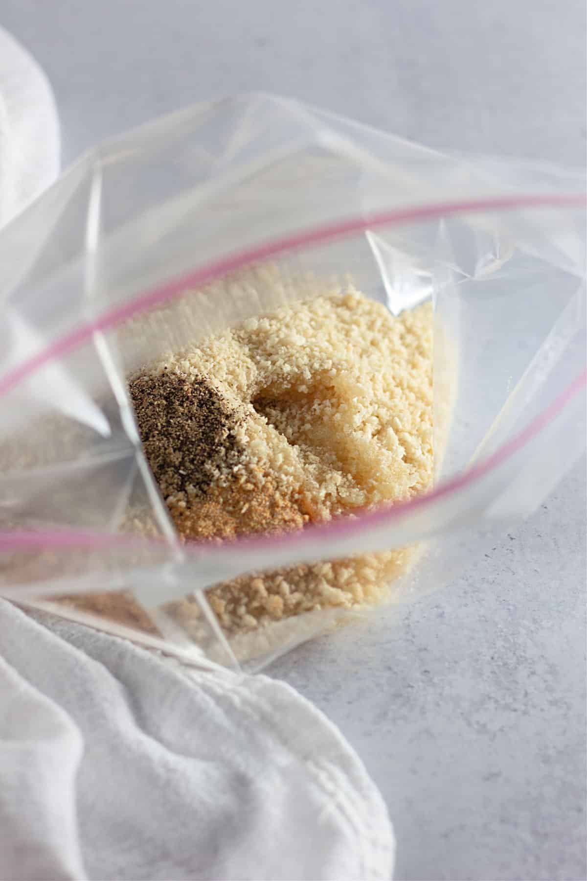 Panko, bread crumbs, and seasoning in a plastic bag. 
